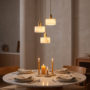 Lune Alabaster Pendant Light above a dining table, natural alabaster and brass pendant light