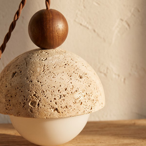Close up of the travertine and glass detail on the Mira Travertine & Glass Pendant
